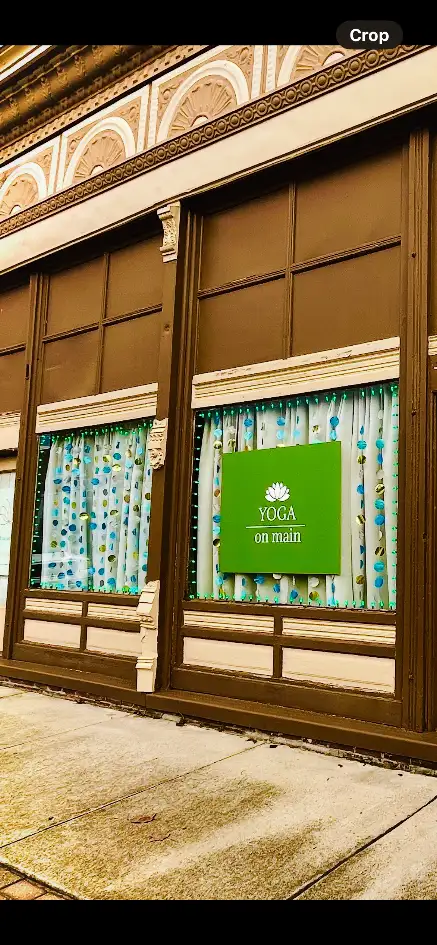 Yoga on Main storefront sign in a window of the historic building on Main Street, Kennett, Missouri
